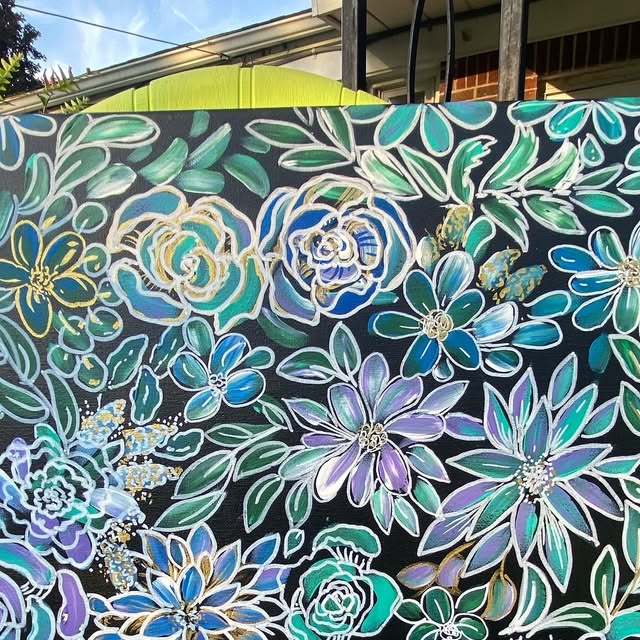 Painting of teal and lavender flowers outlined in white on a black background