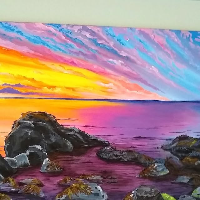 Painting of a vivid pink and orange sunset over a rocky shoreline